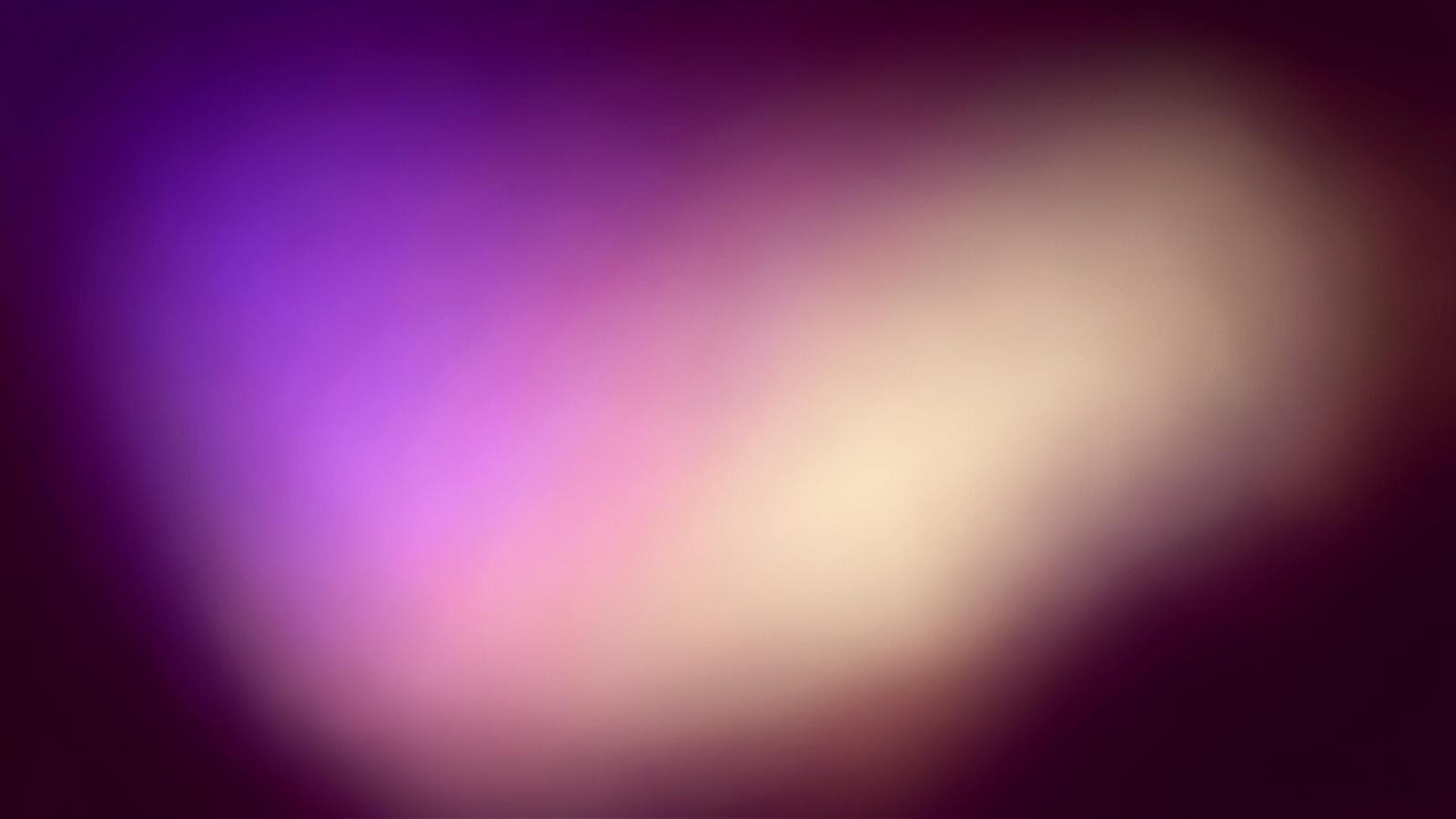 Soft stage lighting in violet and blush tones